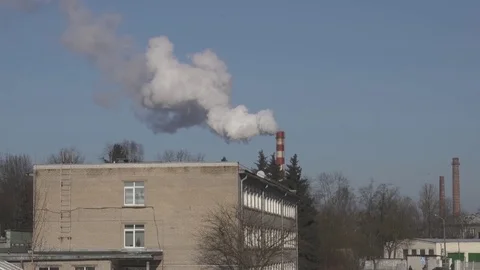 Factory. The smoke comes from the chimney, blue sky, air pollution 動画素材 84701699