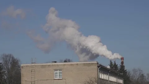 Factory. The smoke comes from the chimney, blue sky, air pollution 動画素材 84857930