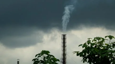 Factory smoke coming out of chimneys with cloudy sky background Stock Footage 319967656