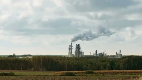 Factory smoke stack and pipes puff into air Stock Footage 72935111