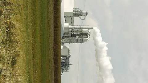 Factory smoke stack and pipes puff into air Stock-Footage 91149952