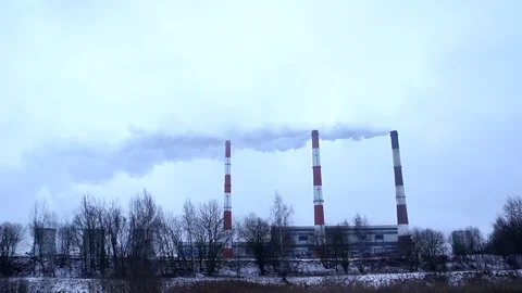 Factory Smoke Stack In Oil And Gas Refinery At Sunset Stock Footage 123955419