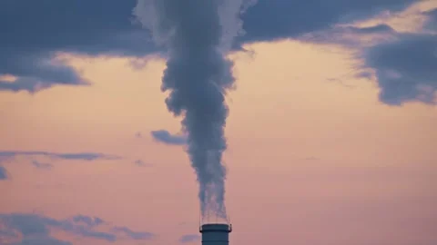 Factory Smoke Stack Releasing Steam into the Atmosphere at Sunset 库存影片 331166281