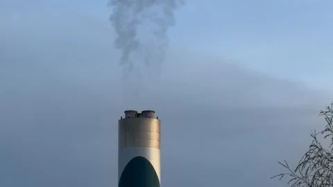 Factory smokestack polluting blue sky detail Stock Footage 332353267