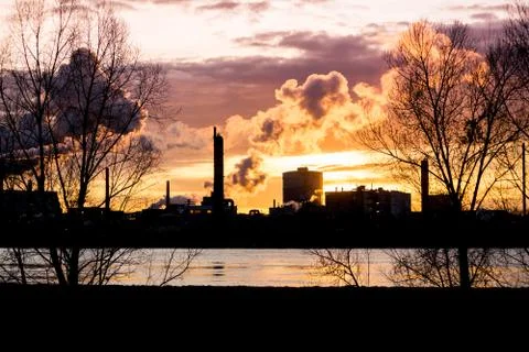 Factory with smokestacks at sunset 写真素材
