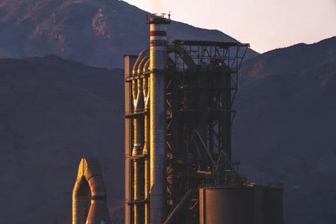 Factory structure with mountains in the background Stock Photos