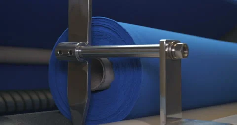 Factory takes a sample of a roll of blue fabric checking the quality Stock Footage 107920724