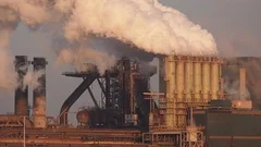 Factory Tata Steel with smoking chimneys on a sunny day, IJmuiden, The  Netherlands Stock Photo