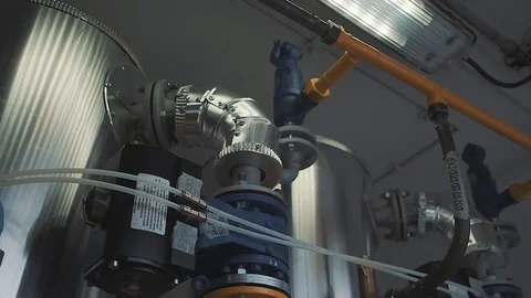 Factory technical industrial compartment with chrome gears and yellow pipes Stock Footage 125881085