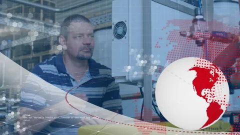 Factory technician checking gauge, adjusting knob to optimize output, tapping Stock Footage 315801132