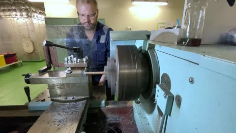 Factory technician controlling device in the metalworking sector Stock Footage 303356964