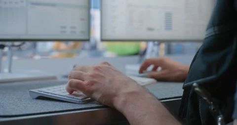 Factory Technician Reviewing Live Robot Arm Streams and Analytics in Smart Stock Footage 344389334
