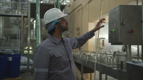 Factory technicians perform routine machinery inspections Stock Footage 308316043