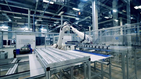 Factory unit with a robotic mechanism relocating solar cells Stock Footage 164655046