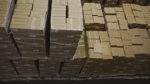 Factory warehouse with stacks of boxes Vídeo Stock 75457690