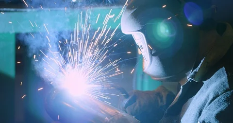 Factory welder welds pipe Stock Footage 104031216