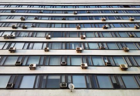 Factory windows with conditioners background Stock Photos