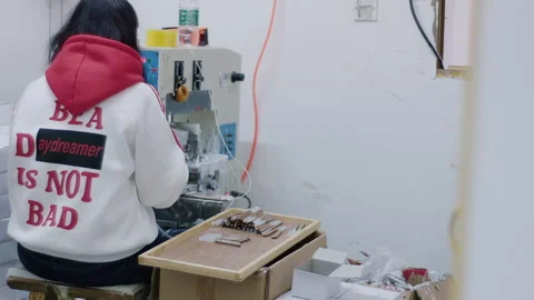 Factory woman operating machine in workshop 스톡 동영상 333212769