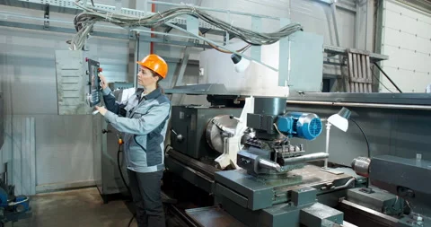 Factory woman worker doing practical work in the factory Stock Footage 144389298
