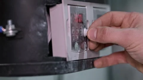 Factory worker adjusting temperature on industrial oven Stock Footage 293691310