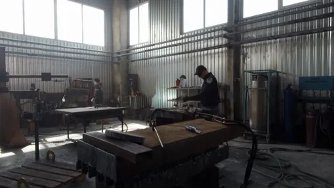 Factory Worker at Advanced Factory of railcar manufacturer train production plan Stock Footage 147156873