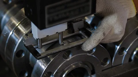 Factory worker applies the mark on product using special equipment. Equipment Vídeos de archivo 127555700