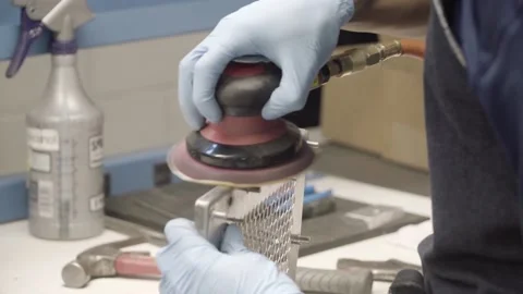 A Factory worker buffing metal grate Video stock 155533206