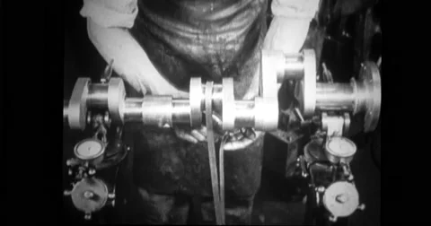 Factory worker checking balance of crankshaft Stock Footage 43397393