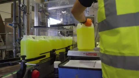Factory Worker Checking Coolant Containers on Production Line Stock Footage 336332133