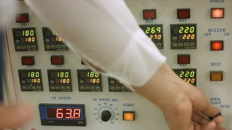 Factory worker checking on factory machinery control panel Stock Footage 86798135