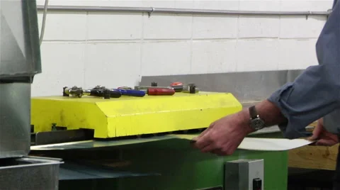 Factory worker creates edging on metal - medium shot Stock Footage 42958231