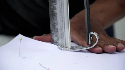 Factory worker cutting of fabric in factory. Used the razor machine for cutti Stock Footage 166045995