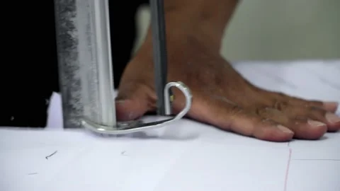 Factory worker cutting of fabric in factory. Used the razor machine for cutti Stock Footage 166046063