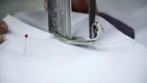 Factory worker cutting of fabric in factory. Used the razor machine for cutti Stock Footage 166046517