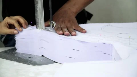 Factory worker cutting of fabric in factory. Used the razor machine for cutti Stock Footage 166046667