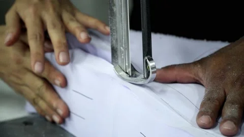 Factory worker cutting of fabric in factory. Used the razor machine for cutti Stock Footage 166046791