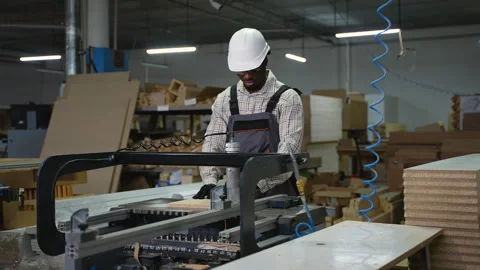 Factory Worker Drilling Wood Board in Furniture Workshop Stock Footage 305597175