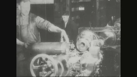 Factory worker fixing shell on rolling machine to give shape - 1918 Stock Footage 83657466