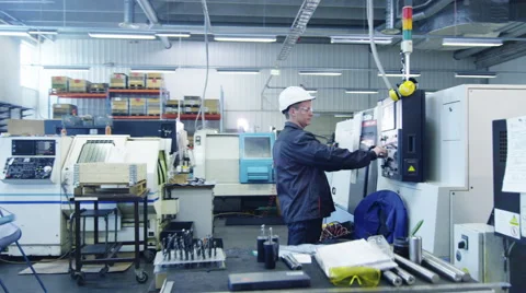 Factory Worker in Hard Hat is Setting Up CNC Lathe Machine 스톡 동영상 53038194