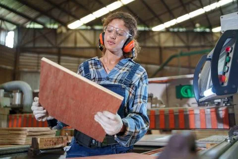 Factory Worker Inspecting Wood Panel on Manufacturing Line Stock Photos