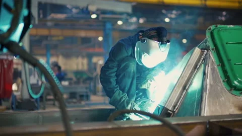 Factory Worker Makes Welds Fusing Metal Parts Of Train Wagon On Production Line Stock Footage 220896150
