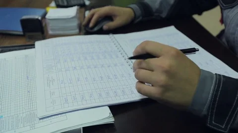 Factory Worker Making Notes At The Desk Video stock 73934390