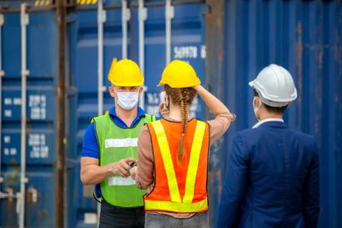 Factory worker man checking fever by digital thermometer for scan and protect Фото