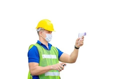 Factory worker man checking fever by digital thermometer for scan and protect Photos