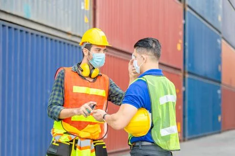Factory worker man checking fever by digital thermometer for scan and protect Stockfoto's