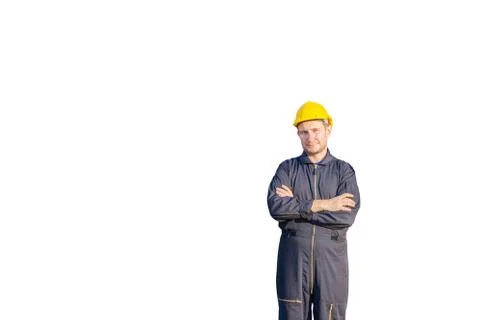 Factory worker man in hard hat smiling with arms crossed Фото