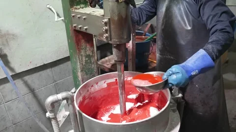 Factory Worker Mixing Red Match Compound With Ladle at Industrial Kettle Vídeo Stock 339736839