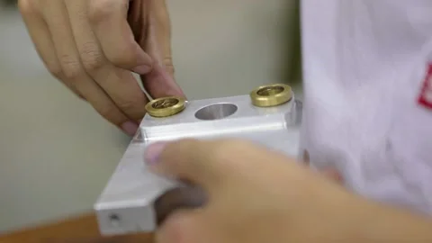 Factory worker mounting machine pieces at industrial floor Stock Footage 133438977