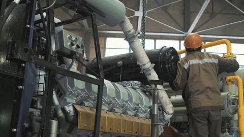 Factory worker opens red metal toolbox standing on the floor Stock Footage 125881393