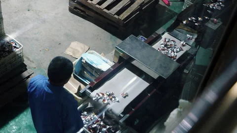 Factory worker operating a candy production conveyor belt Stock Footage 333216636